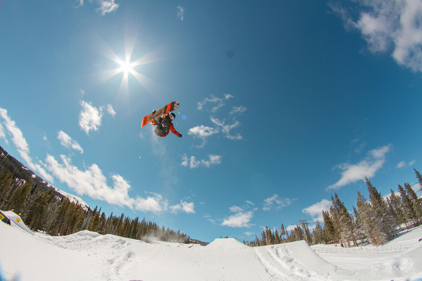 Tommie inverted mid rotation with a grab, high above the jump